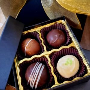 Box of handcrafted chocolate truffles with assorted flavors by Mercedez Rain Chocolates